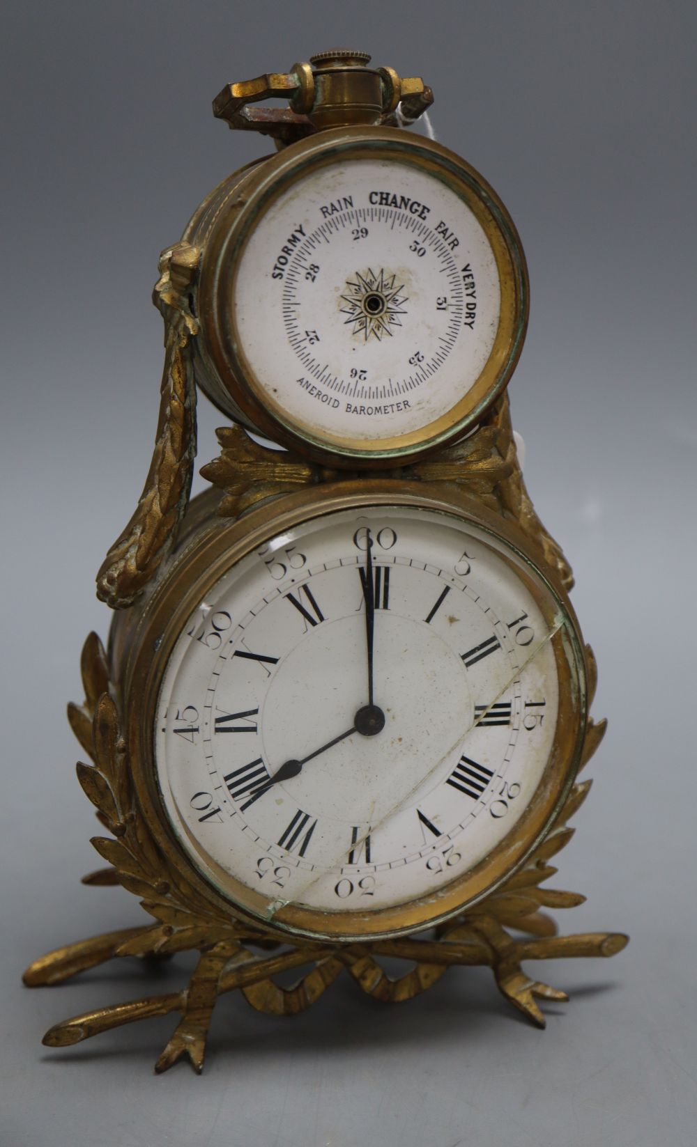 An ormolu desk timepiece and aneroid barometer, height 21cm